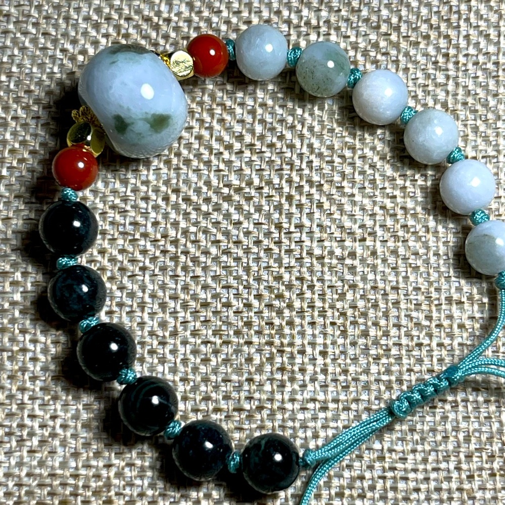 Burma Jade adjustable woven string bracelet, with gold plated accents.